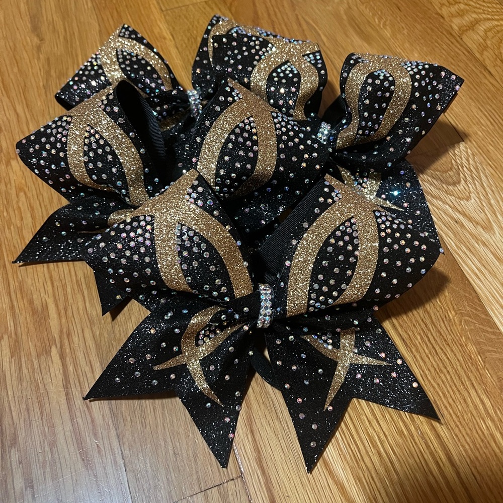 Black and gold cheer bows